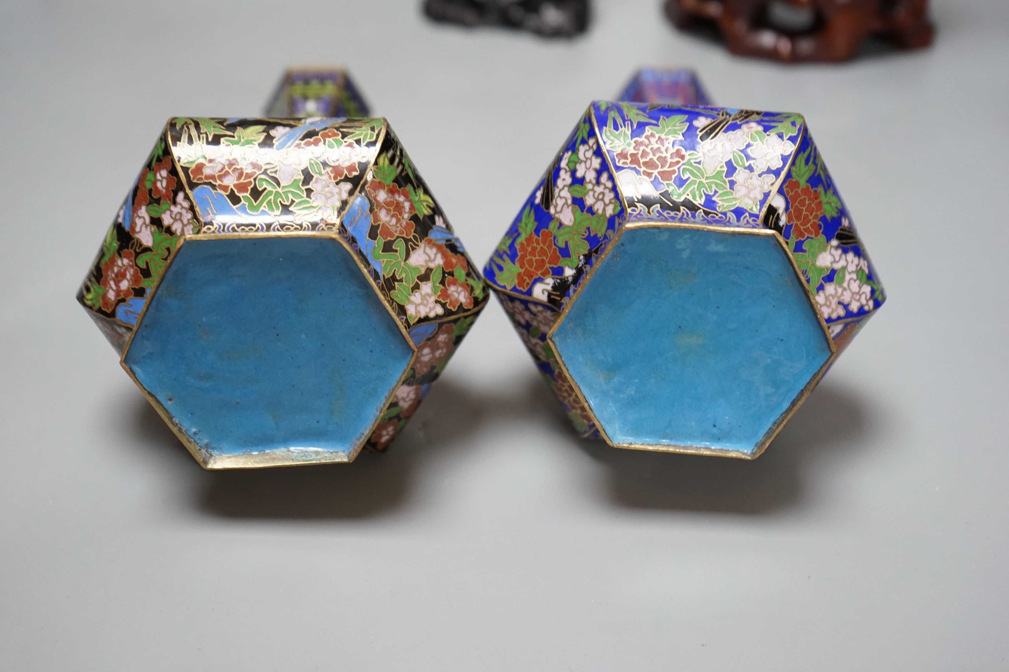 Two Chinese champlevé enamel vases, a soapstone carving and three early 20th century Chinese carved hardwood figures, tallest 26cm